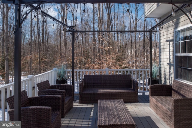 wooden terrace featuring an outdoor hangout area