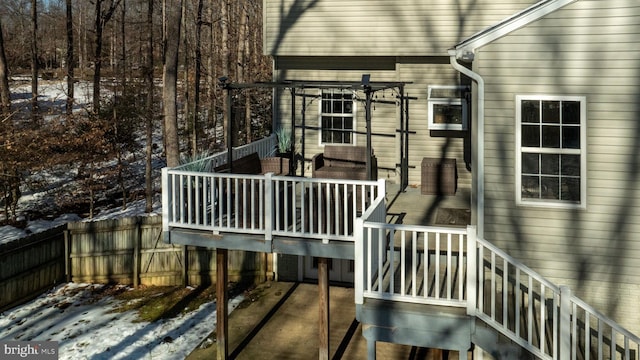 view of snow covered deck