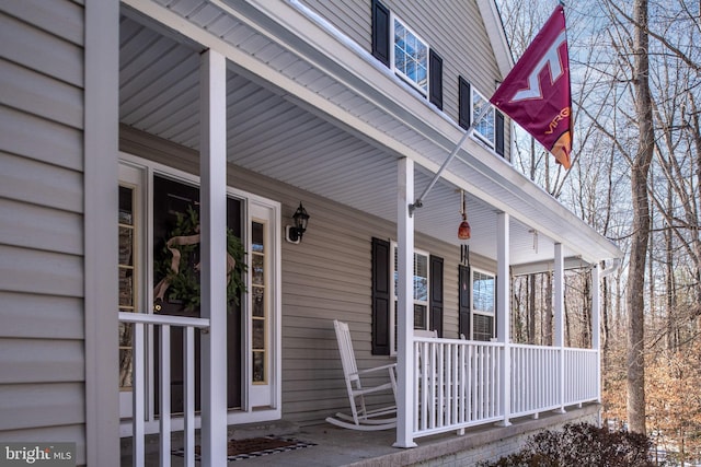 view of side of home with covered porch