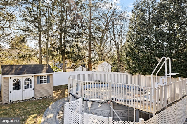 exterior space with a shed and a covered pool