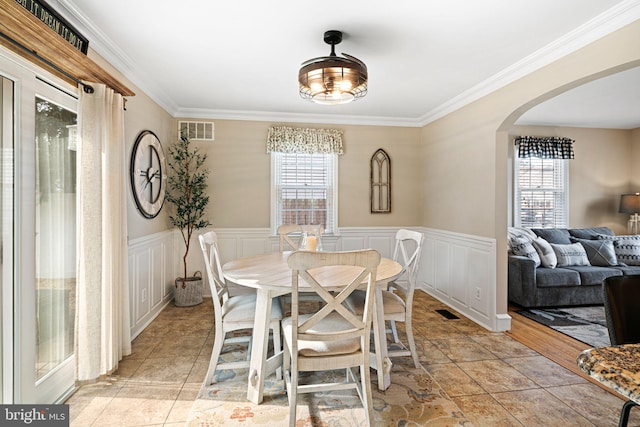 dining room with crown molding