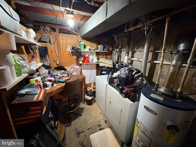 basement featuring water heater and washing machine and clothes dryer