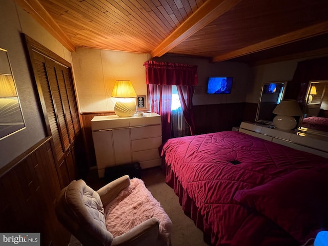 carpeted bedroom featuring wooden ceiling, wood walls, and beamed ceiling