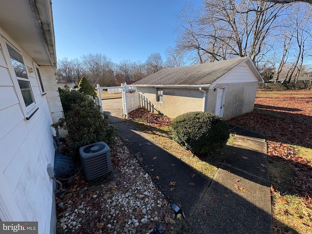 view of side of property with cooling unit