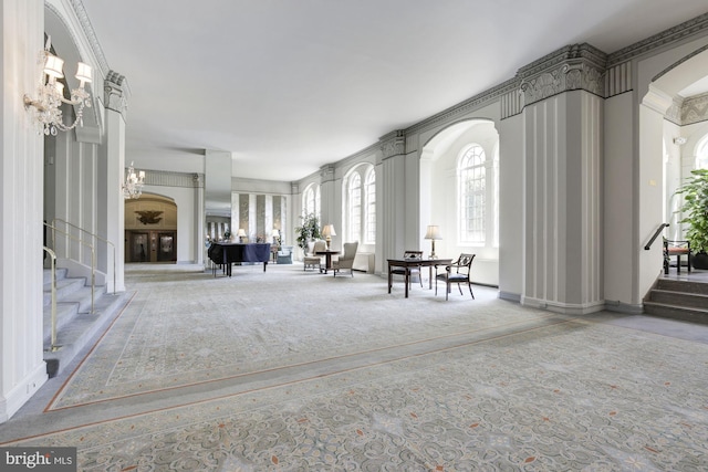 interior space featuring light carpet and ornamental molding