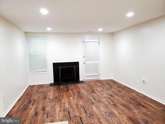 unfurnished living room featuring hardwood / wood-style flooring