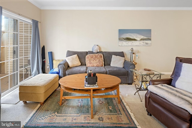 living room with ornamental molding and carpet floors