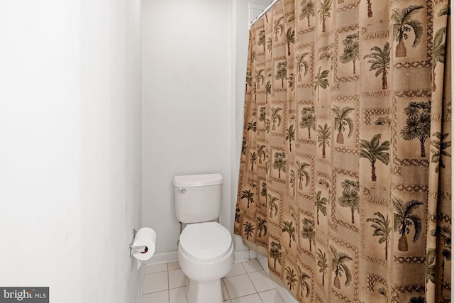 bathroom with toilet and tile patterned floors