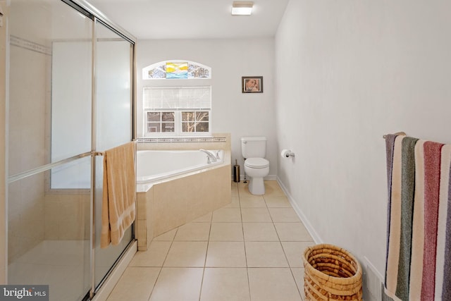 bathroom with toilet, tile patterned floors, and separate shower and tub