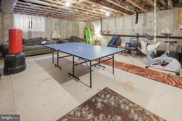 recreation room featuring concrete floors