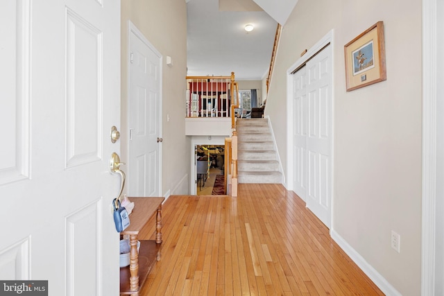 corridor featuring crown molding and hardwood / wood-style floors