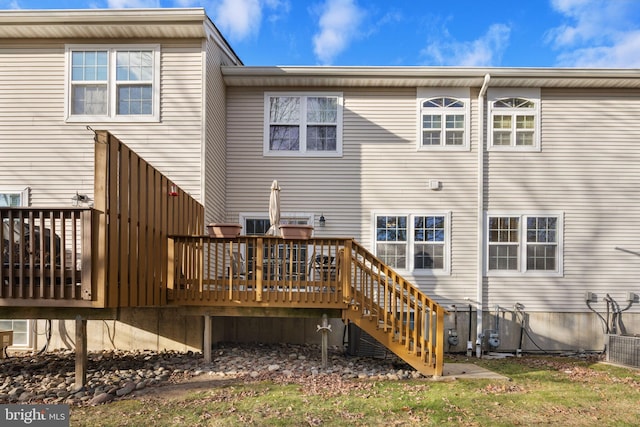 rear view of property with a wooden deck