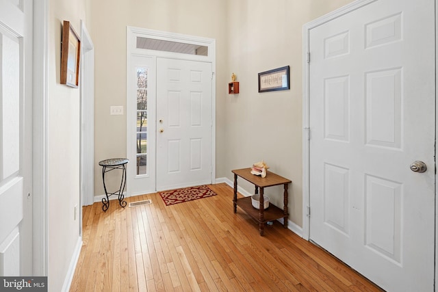 entrance foyer with light hardwood / wood-style flooring