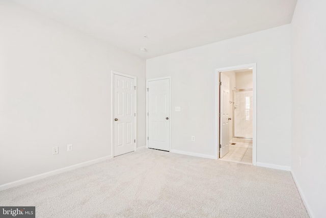 unfurnished room with light colored carpet