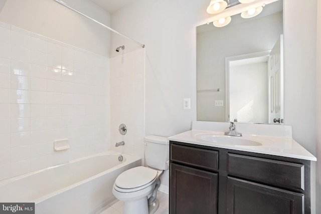 full bathroom featuring tile patterned flooring, toilet, vanity, and  shower combination