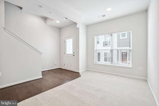 view of carpeted entrance foyer