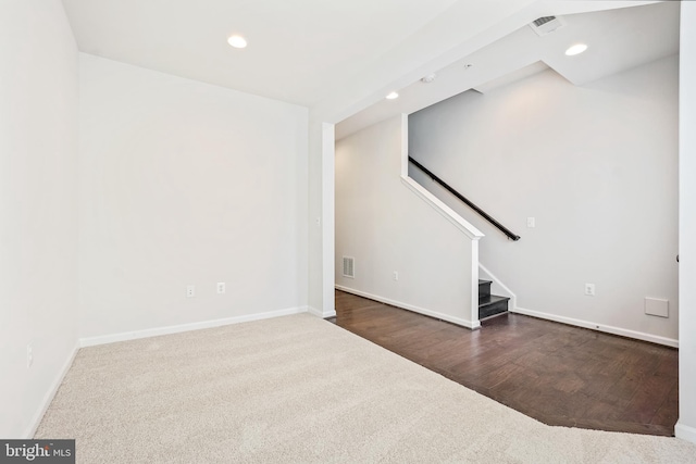 unfurnished living room featuring dark hardwood / wood-style flooring