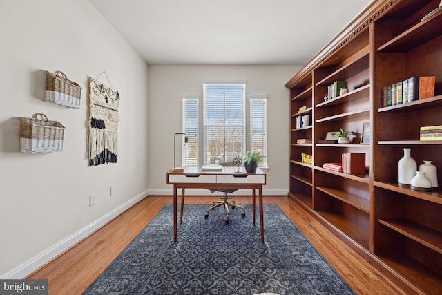 office area with wood finished floors and baseboards