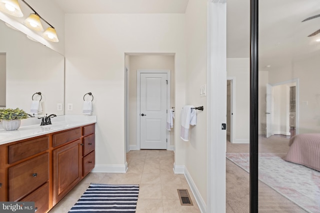 full bathroom featuring visible vents, vanity, baseboards, and tile patterned floors