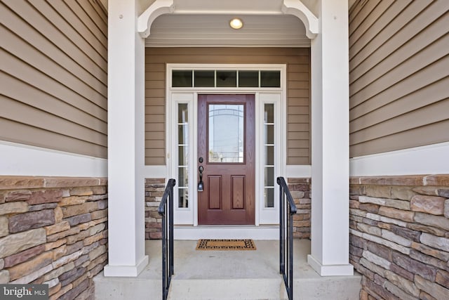 entrance to property with stone siding