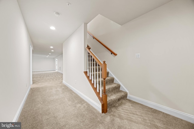 staircase featuring carpet floors, baseboards, and recessed lighting