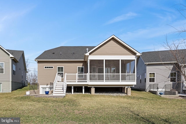 back of house featuring central AC unit, a lawn, a shingled roof, and a sunroom