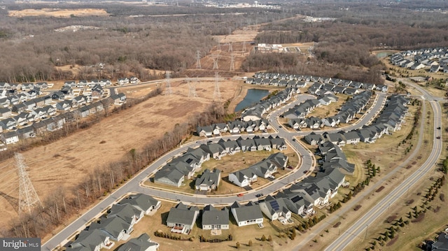 birds eye view of property with a water view and a residential view