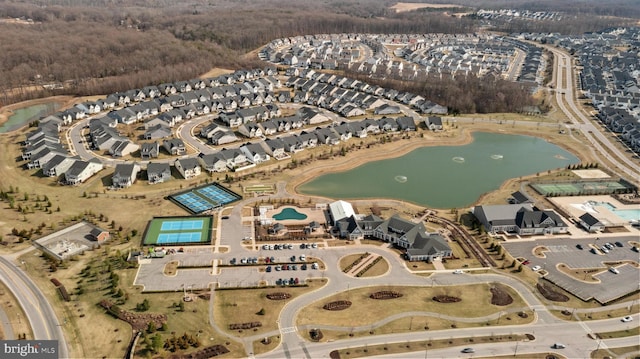 birds eye view of property with a water view