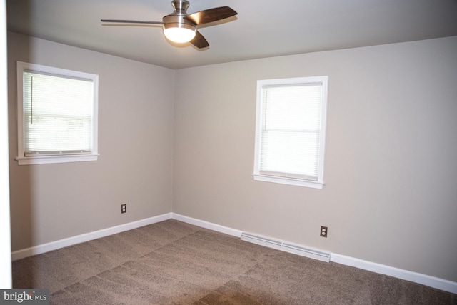 empty room featuring carpet floors, a baseboard radiator, and ceiling fan