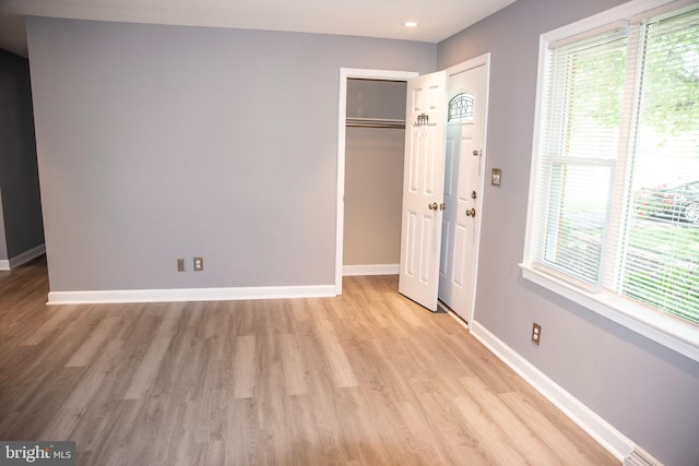 unfurnished bedroom with light hardwood / wood-style floors