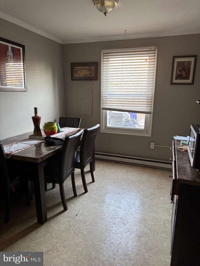 dining space with baseboard heating and ornamental molding