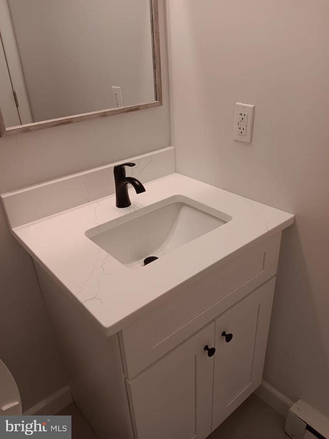 9 Berkshire Rd, Sicklerville, NJ 08081 - half bathroom with vanity and a baseboard radiator