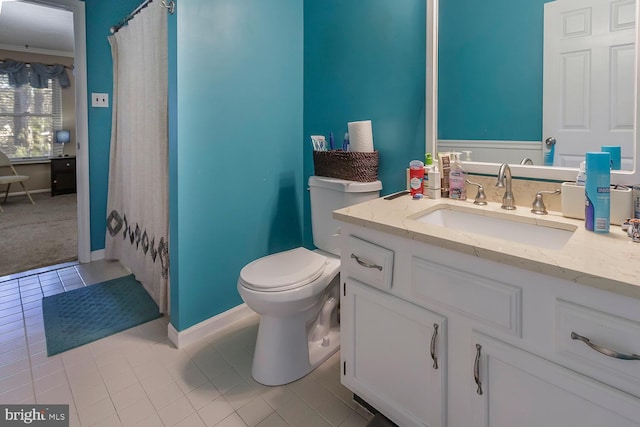 bathroom featuring toilet, vanity, tile patterned flooring, walk in shower, and crown molding