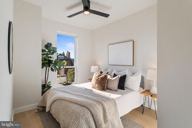 bedroom featuring light wood-type flooring and ceiling fan