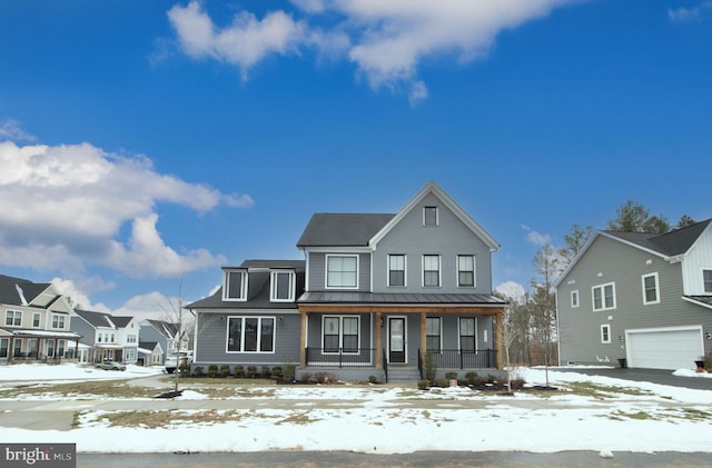 view of front of property featuring a porch and a garage