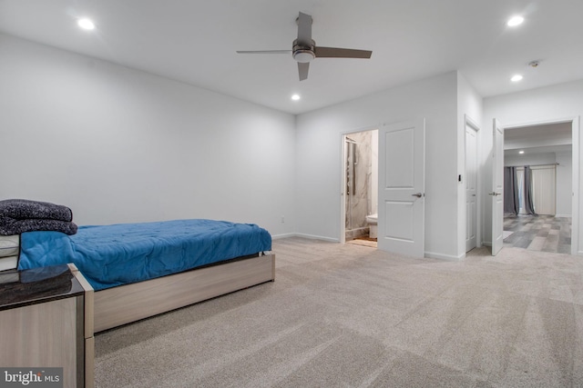 carpeted bedroom with connected bathroom