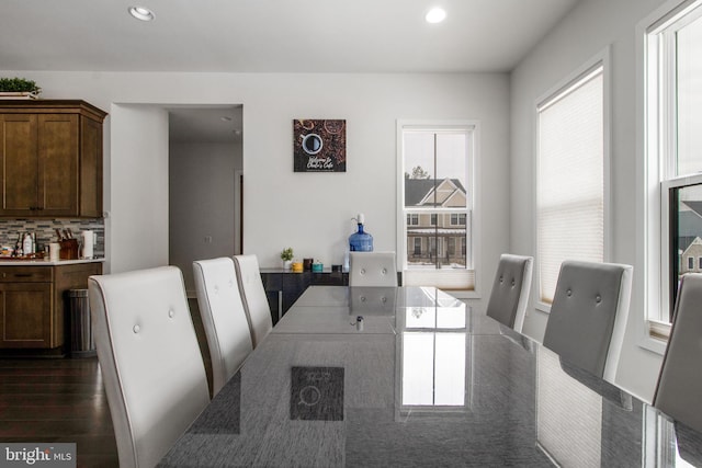 dining area with dark hardwood / wood-style floors