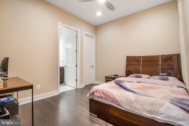 bedroom featuring ceiling fan, dark wood-type flooring, and ensuite bath