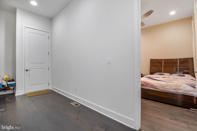 bedroom featuring dark wood-type flooring