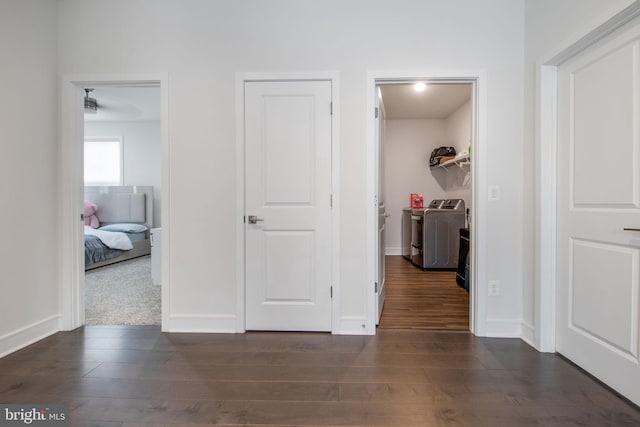 corridor featuring dark hardwood / wood-style floors and washer and clothes dryer