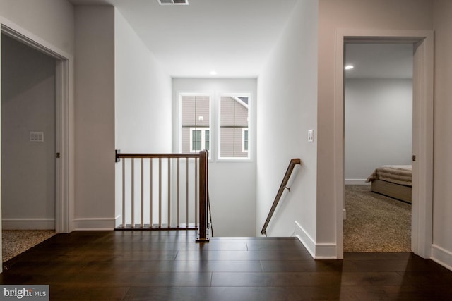 hall featuring dark wood-type flooring