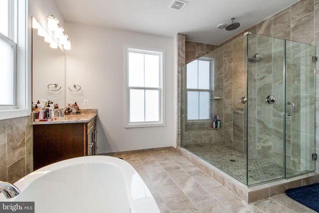 bathroom with vanity, separate shower and tub, and tile patterned floors