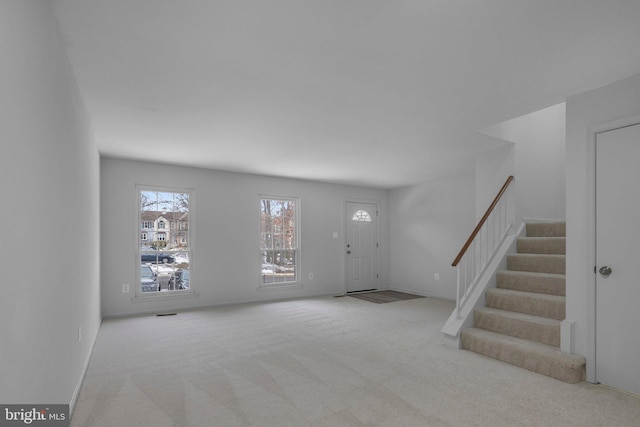 interior space with light colored carpet