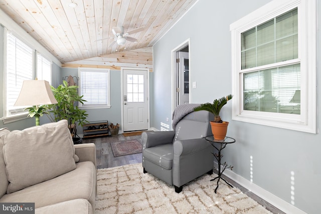 living room with wood-type flooring, vaulted ceiling, wooden ceiling, and ceiling fan