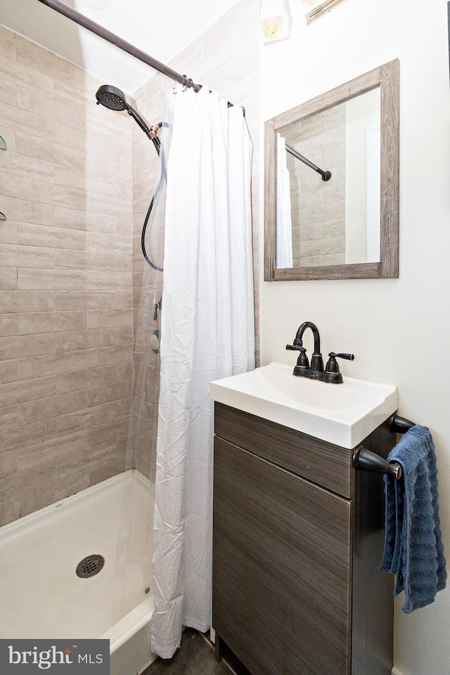 bathroom with vanity and curtained shower