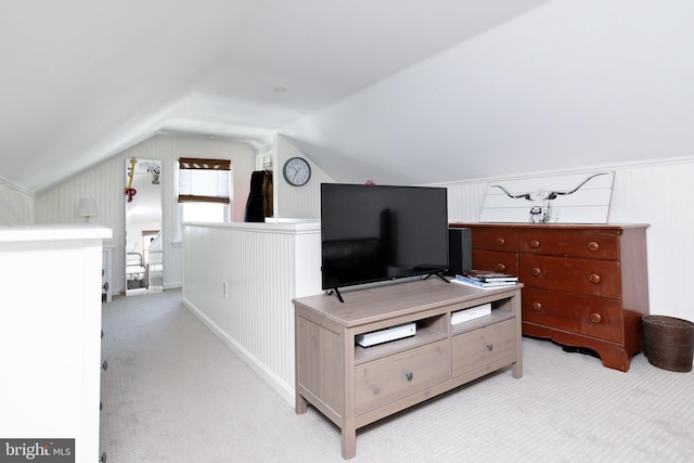 bedroom featuring vaulted ceiling and light carpet