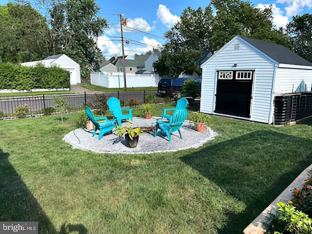 view of yard featuring an outdoor fire pit and a shed