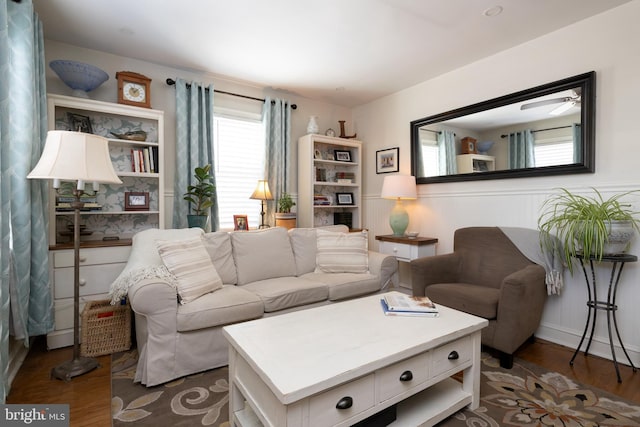 living room with dark hardwood / wood-style flooring