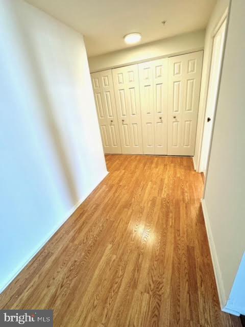 hall with light hardwood / wood-style flooring