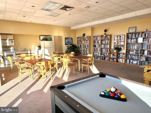 playroom featuring pool table, a paneled ceiling, and carpet flooring